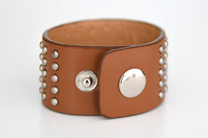 Wide bracelet with metal rivets